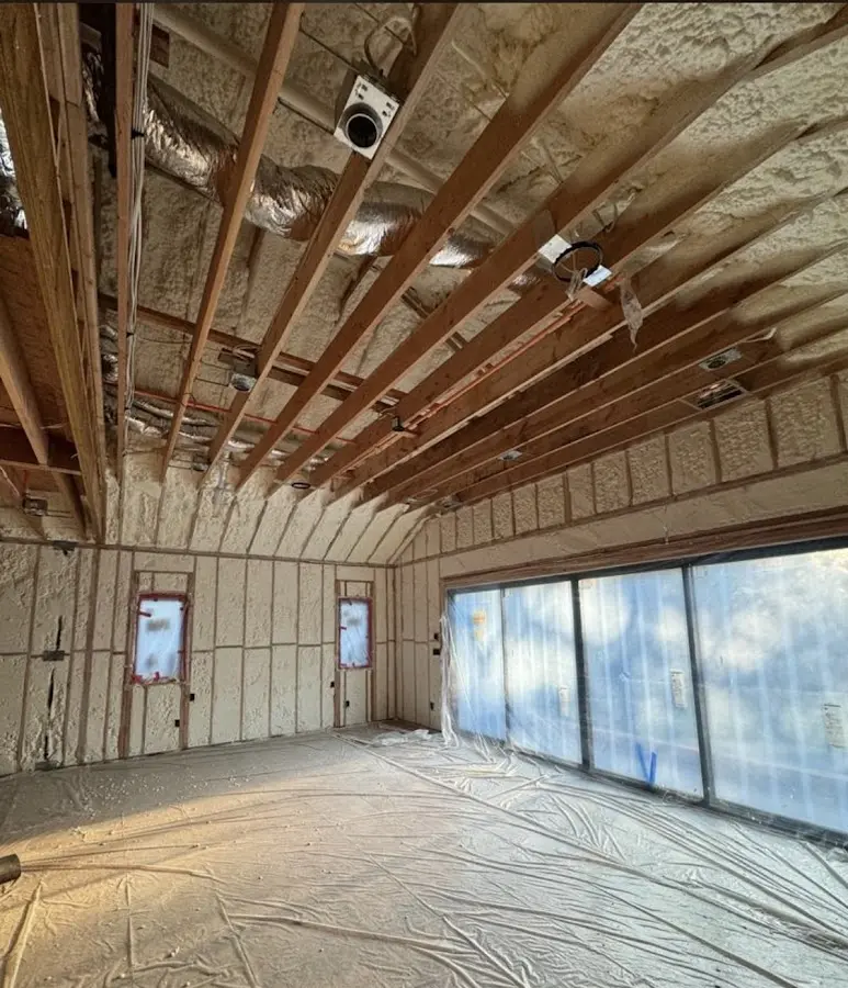 Interior walls and ceiling insulated with spray foam during new construction in Rapho